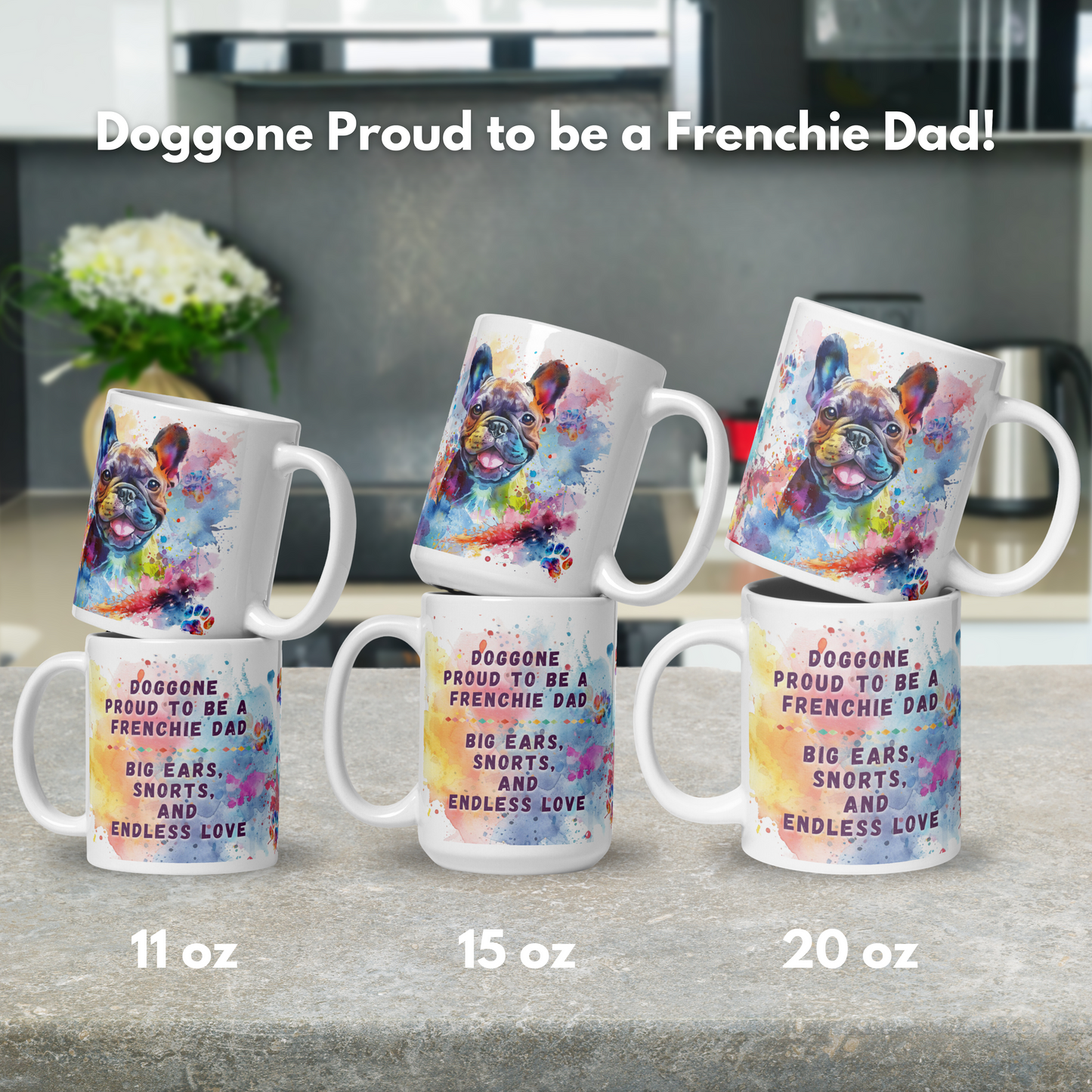 Doggone Proud to be a French Bulldog Dad Mug. Mug has a Frenchie surrounded by watercolor Clouds and Paws. Mug comes in 11oz, 15oz, and 20oz. Mugs stacked by size to show front and back on a stone counter.