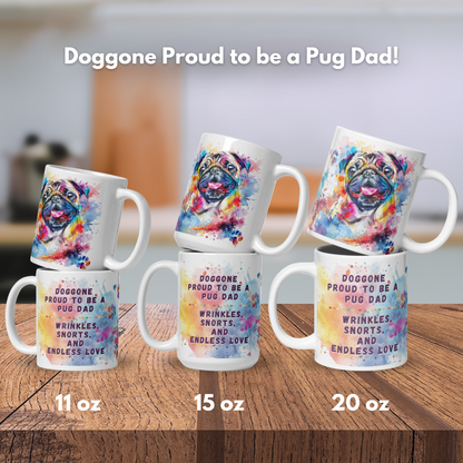 Doggone Proud to be a Pug Dad Mug. Mug has a Pug surrounded by watercolor Clouds and Paws. Mug comes in 11oz, 15oz, and 20oz. Mugs stacked by size to show front and back on a wood counter.