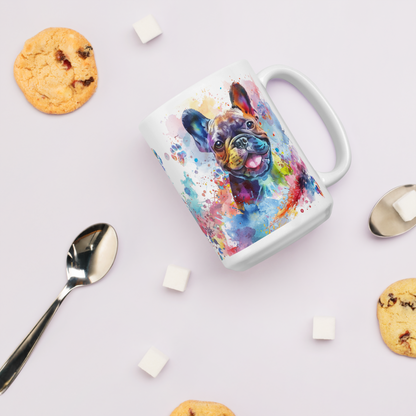 Doggone Proud Frenchie Dog Mug. A fun colorful mug with handle showing a happy French Bulldog surrounded by watercolor splashes, clouds, and paws. Mug is laying flat with cookies around it.