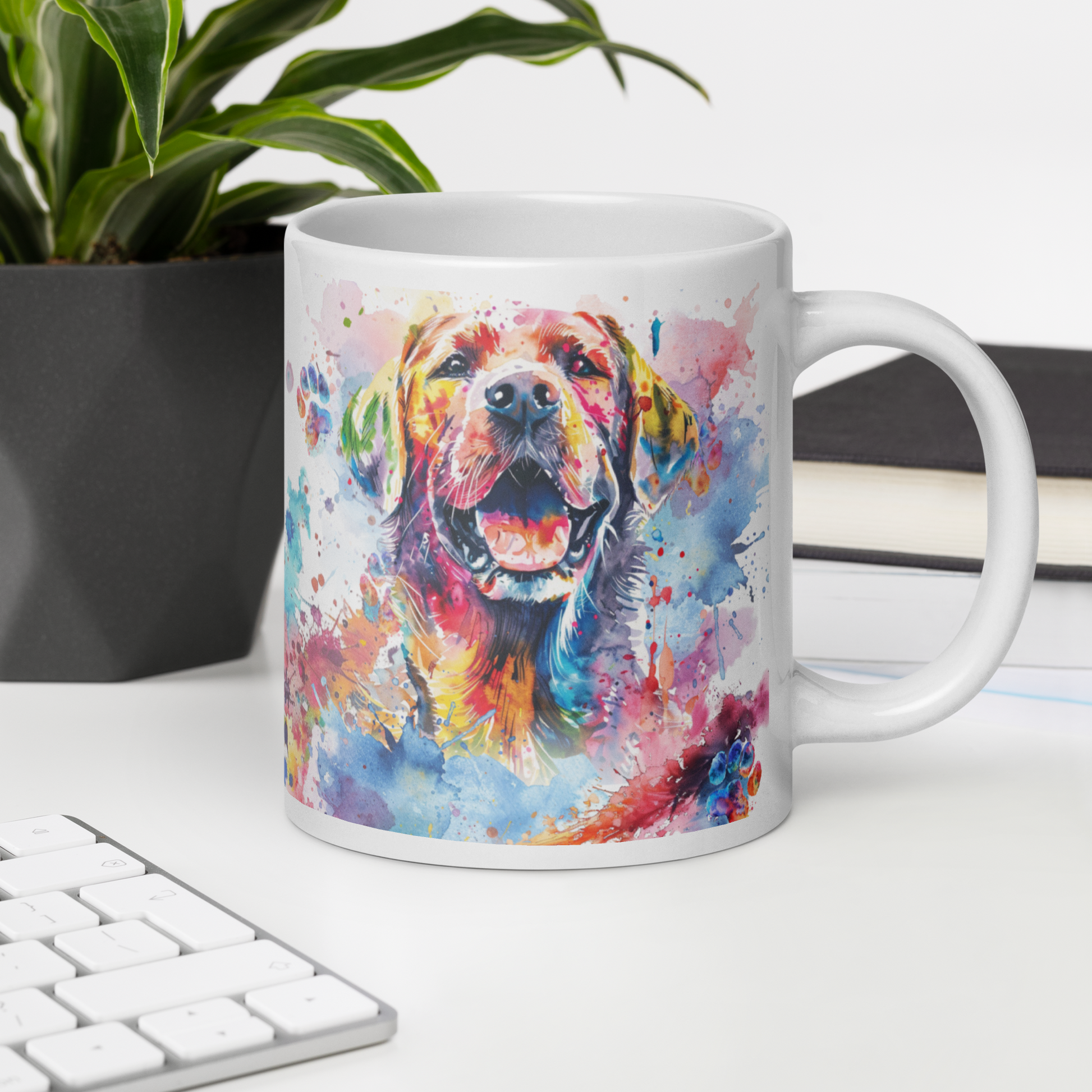 Doggone Proud Lab 20 oz Large Big Mug. A fun mug with a happy Labrador Retriever dog surrounded by colorful watercolor splashes, clouds, and paws. Mug is on a white desk with a plant book and keyboard. Great give for any dog lover or paw-rent.